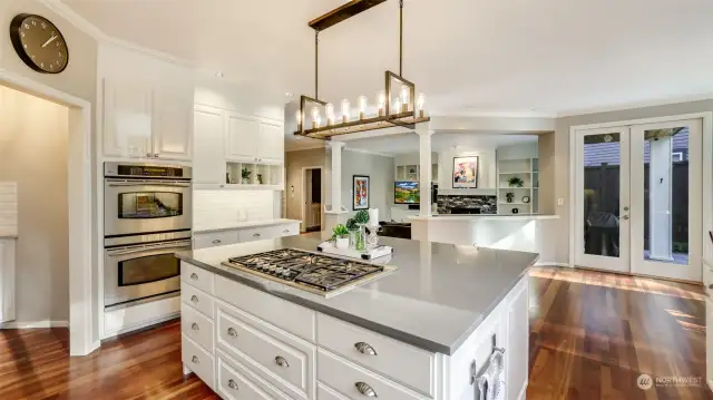 Double ovens and butler's pantry to the left add to the ease of entertaining.