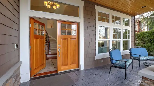 Charming covered porch with stamped concrete accents welcomes you in.