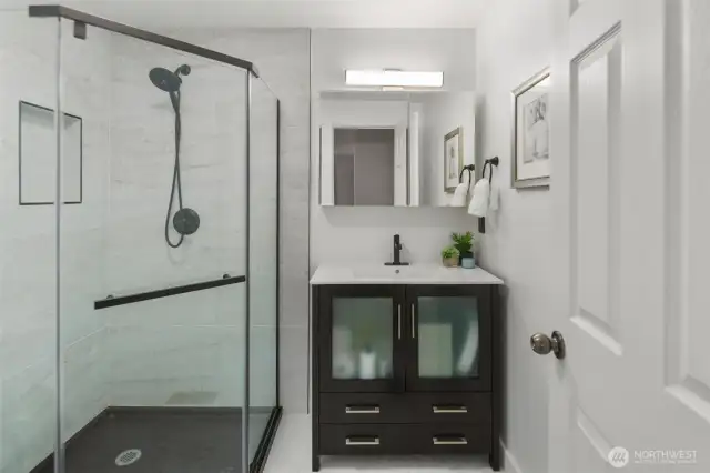 Primary bedroom with ensuite bathroom features a large shower for all your needs!