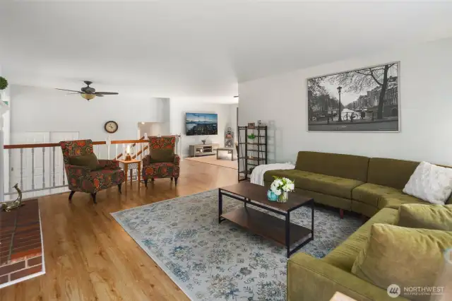Welcome home! A spacious entryway greets you with the living room to the right and the dining room next to it. The open staircase railing is a custom feature allows for abundant light to flow throughout.
