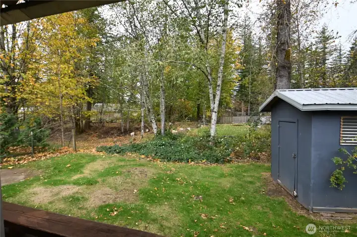 Enjoy serene views from your covered back deck as goats wander the neighboring property. Delightful setting.