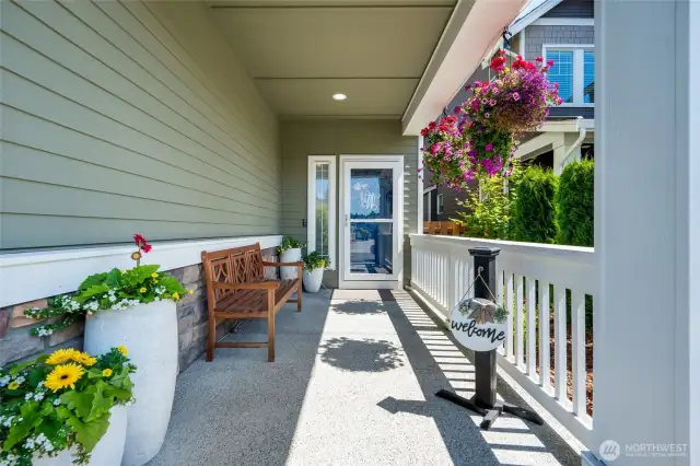 Great planning for Summer baskets - the hanging baskets are on an automatic drip system and they love the location!. Front entry, covered porch with storm door.  You are welcomed to sit, take your shoes off, and come on in.