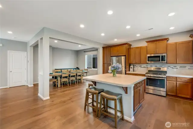 Open kitchen and dining space which allows room for an extended table and hutch.  Island seating on two sides. Many of the cabinets have custom pull out drawers on the lower and upper cabinets.