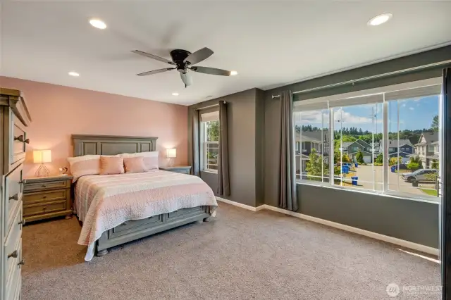 Another view of the bonus room with ceiling fan.