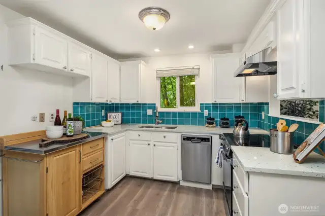 Island at left is moveable to provide extra counterspace where you want it