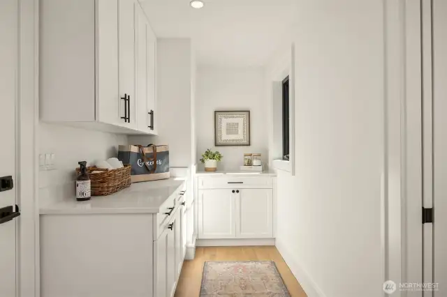 Utility room on main floor with ample storage