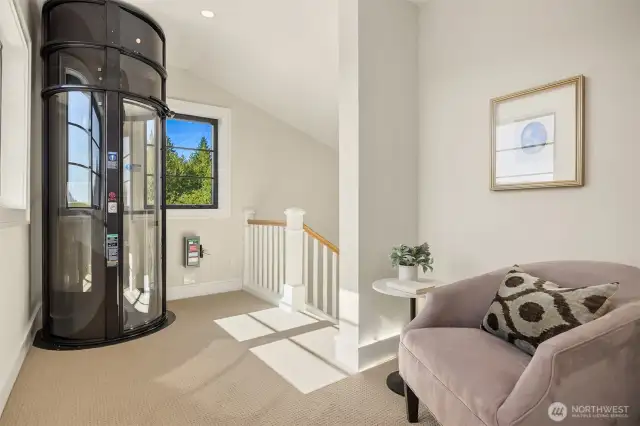 Upper floor/Primary Suite landing with elevator service to main floor.
