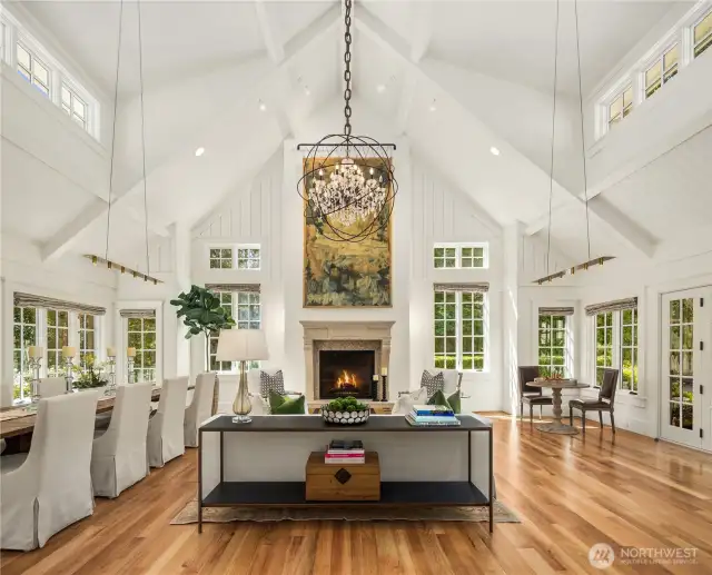 Striking great room boasts a 20+ foot vaulted ceiling with dormered windows