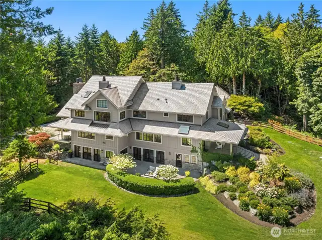 This stately residence is surrounded by manicured lawns and mature landscaping and has a fully fenced backyard