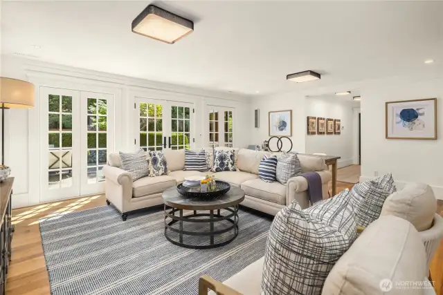 French doors from all rooms lead to out to the rear patio and garden