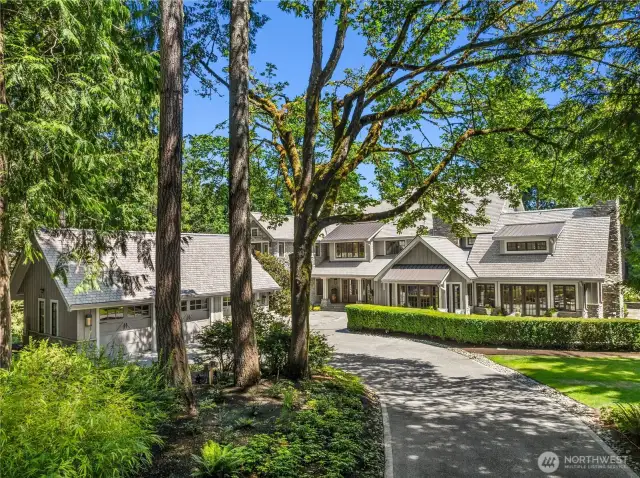 A circular driveway and 3 car detached garage round out this elegant estate