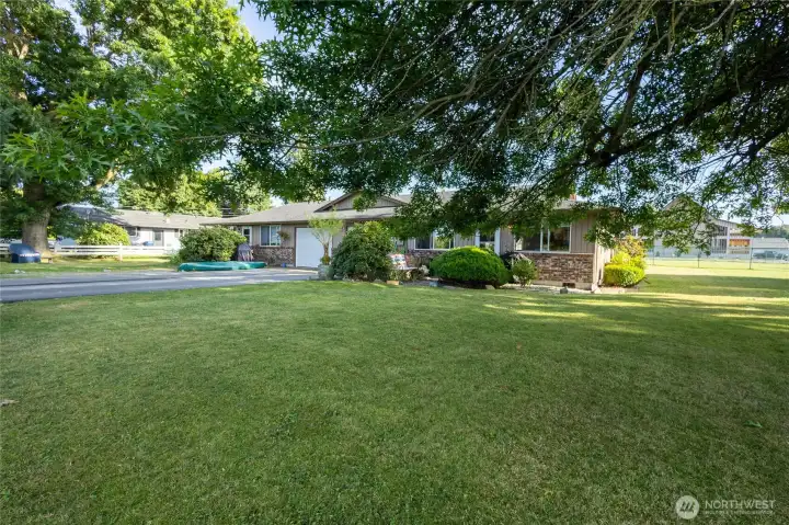 Large yard offering privacy and mature landscaping