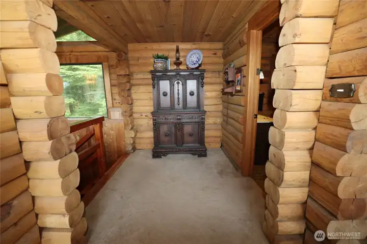 Half bathroom off the living area and stairs to the bedrooms