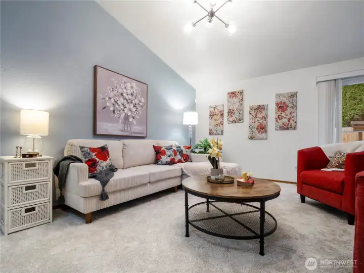 Curl up with a good book or have lively conversations with friends in this spacious living room.
