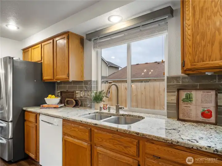 The dishes will be well lit in this kitchen. The large window let's in so much natural light.