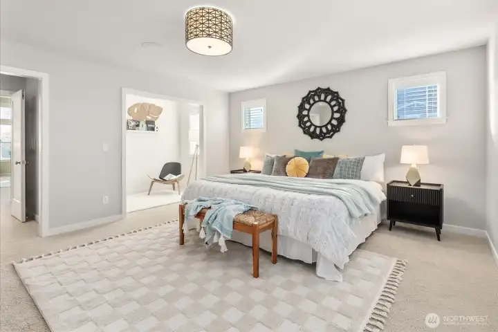 Primary bedroom featuring large nook, 5-piece bath, built-in speakers, and walk-in closet.