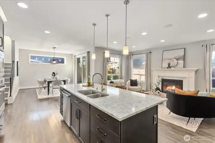 Open floor plan between kitchen, living, and dining.