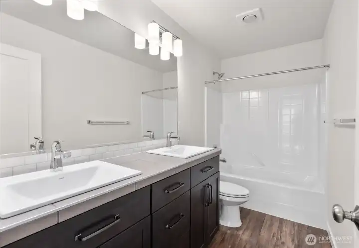 Third full bath, located upstairs.