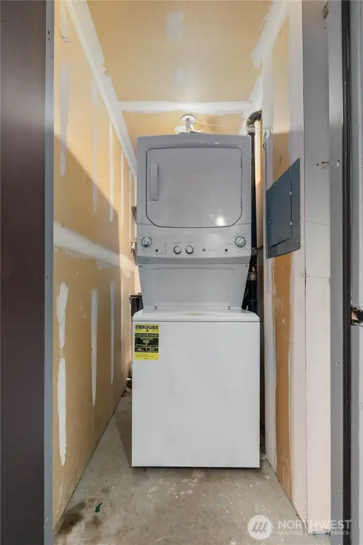 Private laundry just outside front door in utility closet