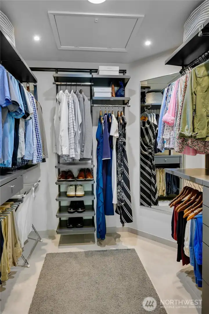 Spacious & organized walk-in closet with Californian Designed shelving.