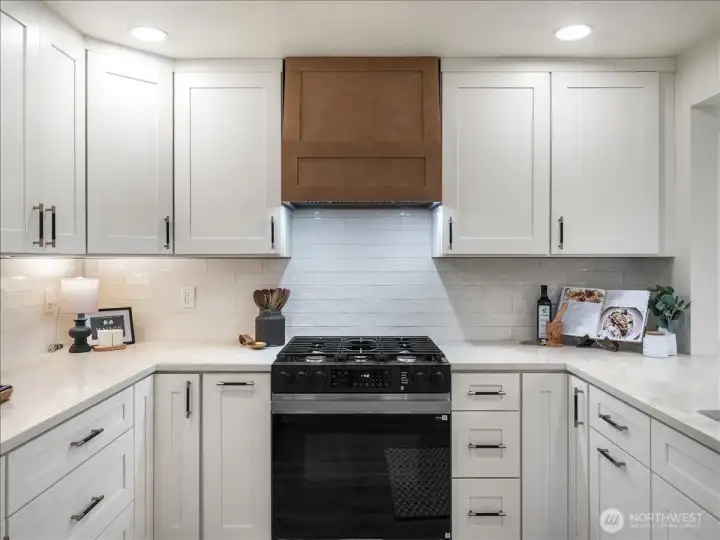 Kitchen cabinets, stove and hoodvent