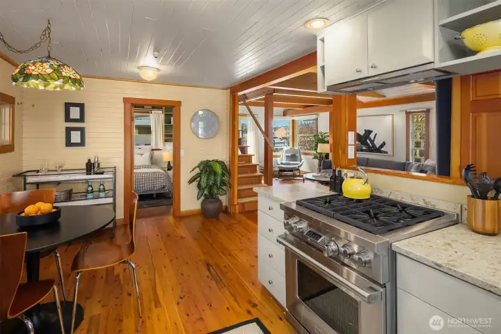 The open sightlines from kitchen to living room to bedroom give the home a surprisingly spacious feel, with warm hardwood floors tying every space together.