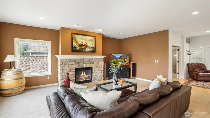 Recessed lighting illuminates this warm and inviting living space, creating the perfect ambiance day or night