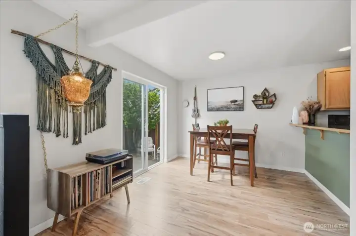 Eating area with slider to the back patio and detached two car garage