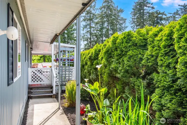 Private covered walkway lined with mature landscaping creates a peaceful and inviting approach to the home. Private covered walkway lined with mature landscaping creates a peaceful and inviting approach to the home.