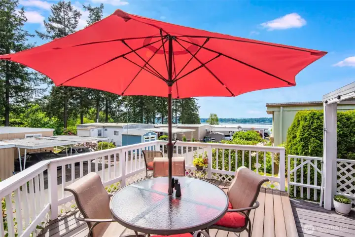 The spacious entertaining deck offers front-row seats to colorful sunsets and relaxing waterfront scenery. The spacious entertaining deck offers front-row seats to colorful sunsets and relaxing waterfront scenery.