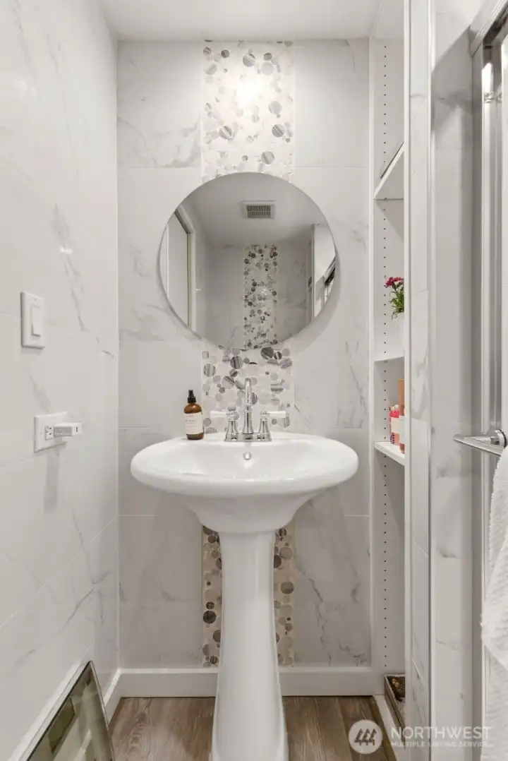 Updated Owner’s Suite bathroom showcases a stylish vanity, eye-catching tile accents, and spa-inspired finishes throughout. Updated Owner’s Suite bathroom showcases a stylish vanity, eye-catching tile accents, and spa-inspired finishes throughout.