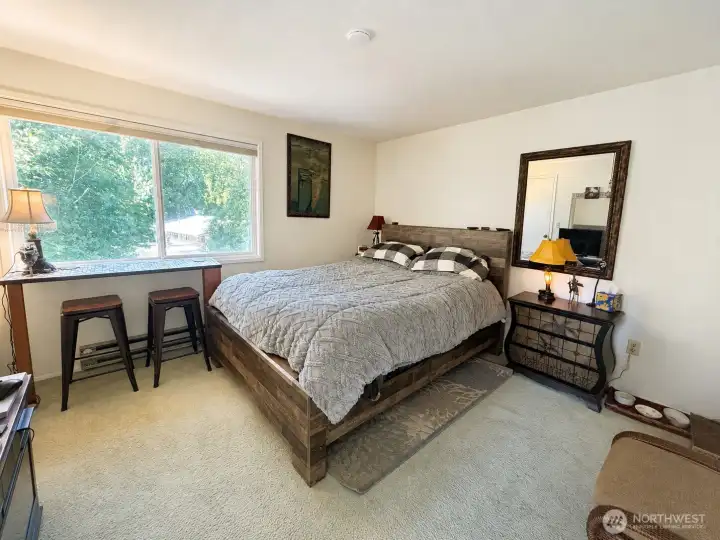 Spacious primary suite with walk in closet, window over looking serene back yard & deck. Spacious primary suite with walk in closet, window over looking serene back yard & deck.