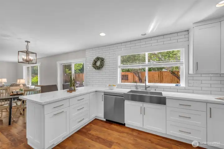 Enjoy the large kitchen peninsula with seating, the coffee bar, the beautiful quartz countertops and farmhouse style sink and stainless steel appliances. Enjoy the large kitchen peninsula with seating, the coffee bar, the beautiful quartz countertops and farmhouse style sink and stainless steel appliances.