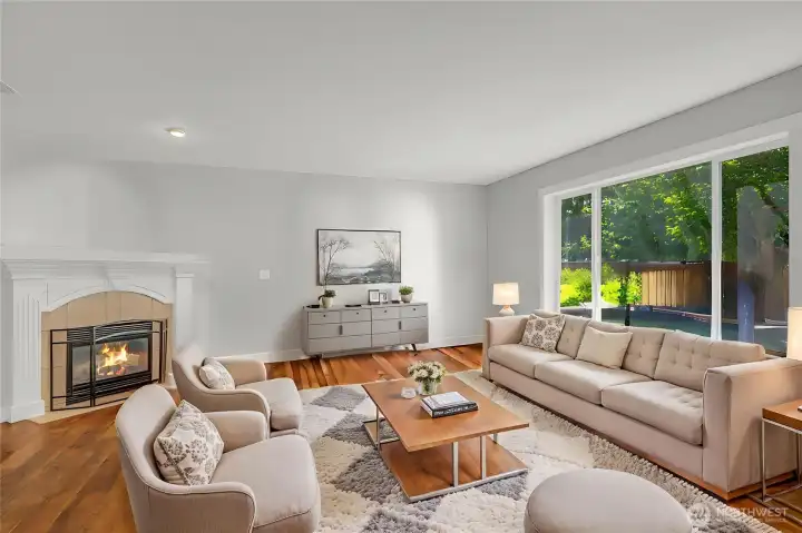 Gas fireplace and exceptionally large windows overlook the stunning custom landscaped backyard with entertaining spaces for your perfect summer. Gas fireplace and exceptionally large windows overlook the stunning custom landscaped backyard with entertaining spaces for your perfect summer.