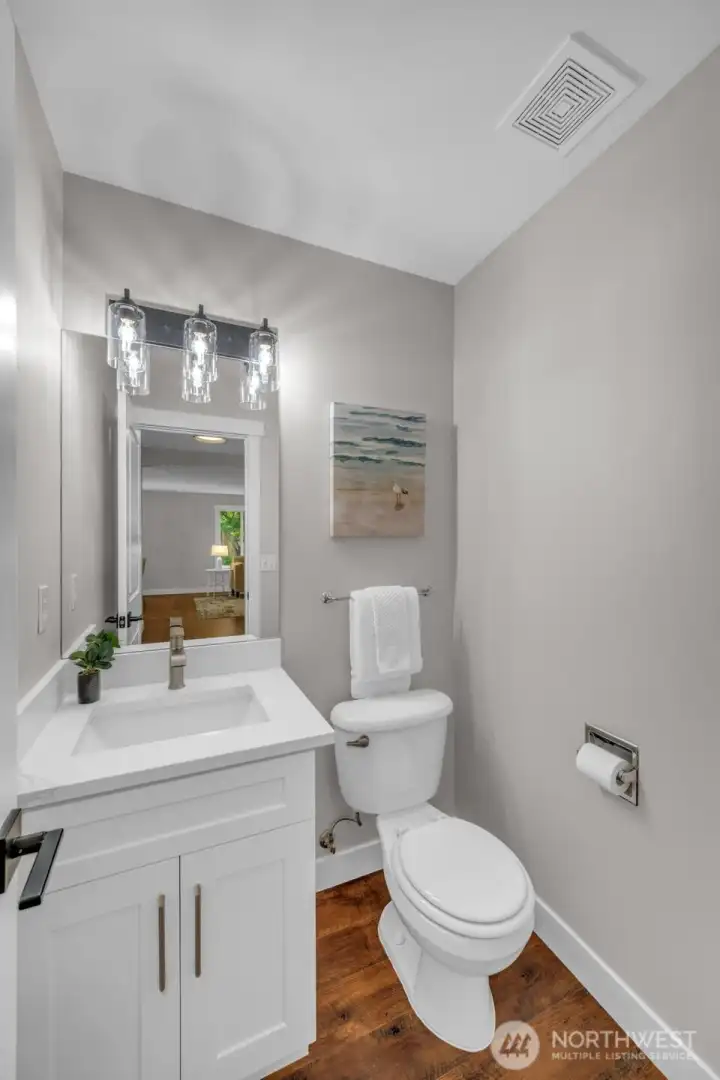 Conveniently located private half bath near downstairs Den. Conveniently located private half bath near downstairs Den.