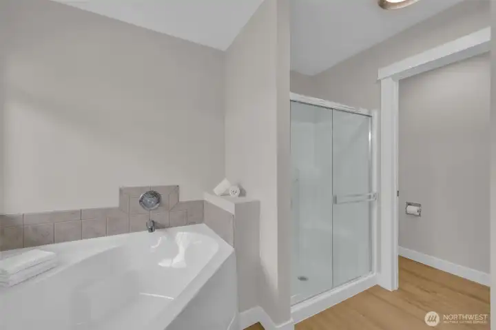Primary bath with classic 5 piece tub, shower, separate toilet room, walk in closet and brand new double sink vanity Primary bath with classic 5 piece tub, shower, separate toilet room, walk in closet and brand new double sink vanity