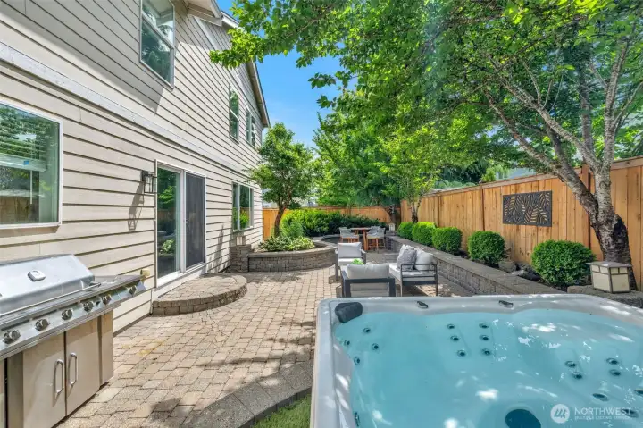 Hot tub and an exceptionally landscaped backyard Hot tub and an exceptionally landscaped backyard