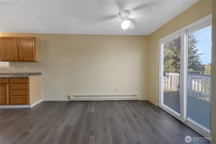 Nice dining area with a slider door that steps out to the deck.