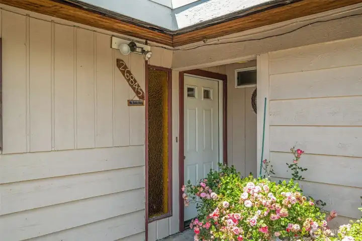 Covered front door awaiting your arrival.