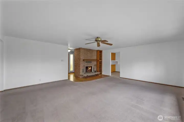 Huge living room with a fireplace.