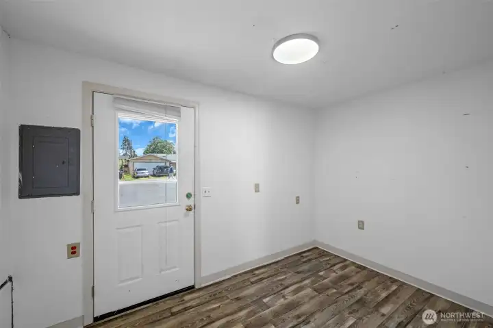 Another door entering the home into a mud room