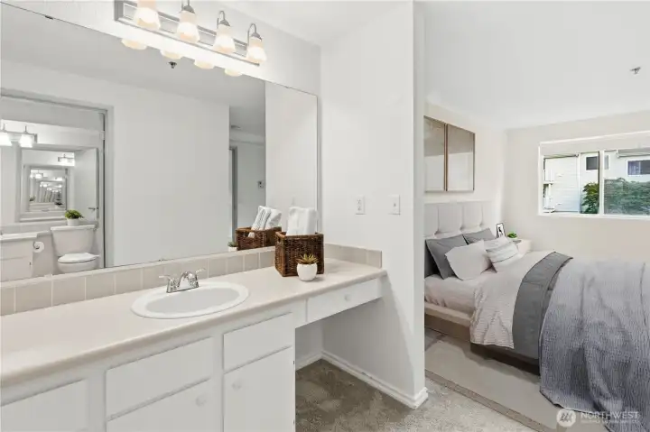 The private vanity sink with additional storage cabinets and newer light fixtures. (Virtual Staging) The private vanity sink with additional storage cabinets and newer light fixtures. (Virtual Staging)
