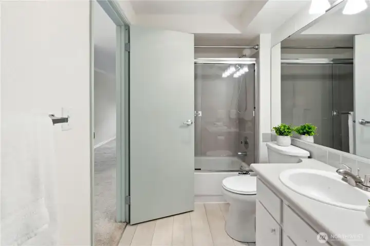 The bathroom with soothing tones, newer laminate hardwood flooring and newer plumbing and light fixtures. The bathroom with soothing tones, newer laminate hardwood flooring and newer plumbing and light fixtures.