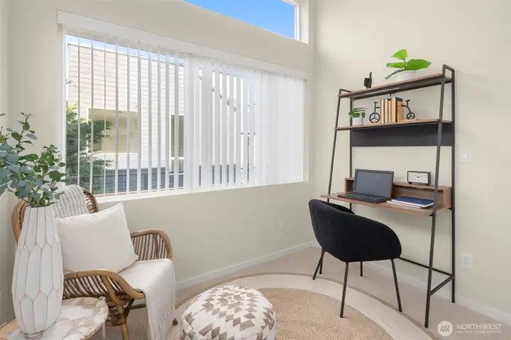 Flexible upper-level room — ideal as a reading nook, home office, or creative studio space flooded with natural light.
