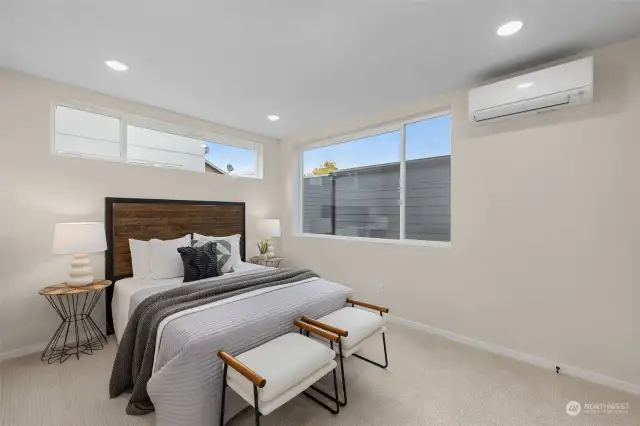 Wake up to natural light pouring in from oversized windows—this primary suite is a dream. Vaulted ceilings add to the airy feel, while the plush carpeting makes it the perfect retreat. The only problem? You may never want to leave!