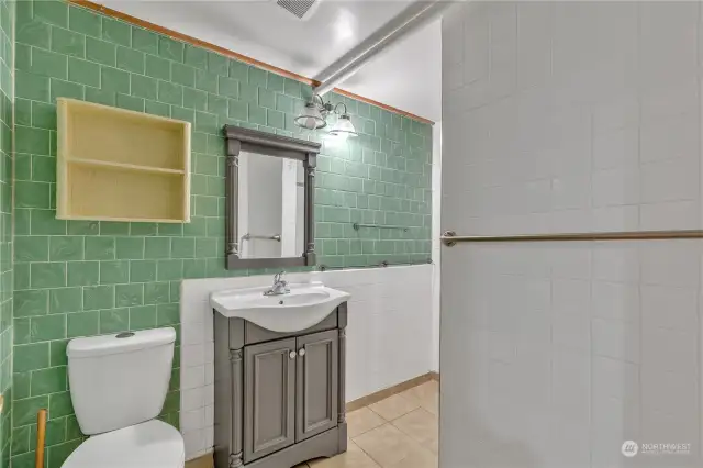 Fun color scheme in this 3/4 bath. Shower just behind this wall.
