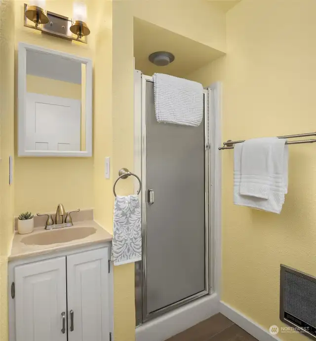 A bright and minimalist half bath just off the garage and utility area.