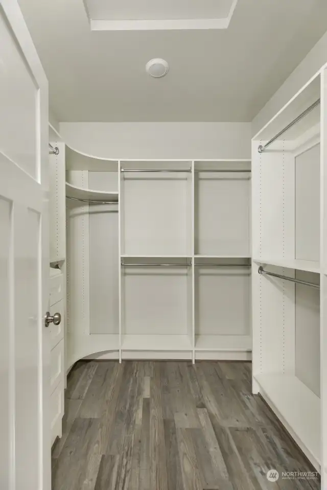 Primary bedroom walk-in closet