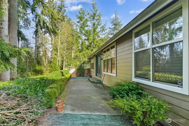 Easy care patio and artificial turf in the back.