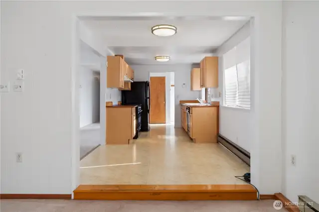 Looking from the family room toward the dining room and kitchen. The living room is to the left.